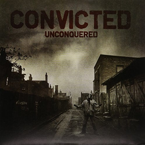 Album cover with text Convicted Unconquered and a figure in a desolate urban street.