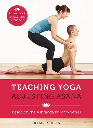 Book cover showing a yoga teacher adjusting a student's poseCBSH pose.