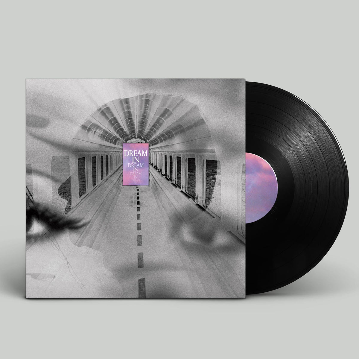 Vinyl record with album art depicting a long, vanishing road.