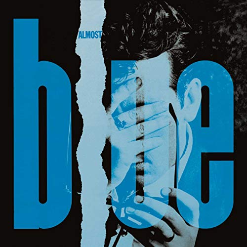 Album cover for Costello’s “Almost Blue” featuring a distorted portrait.