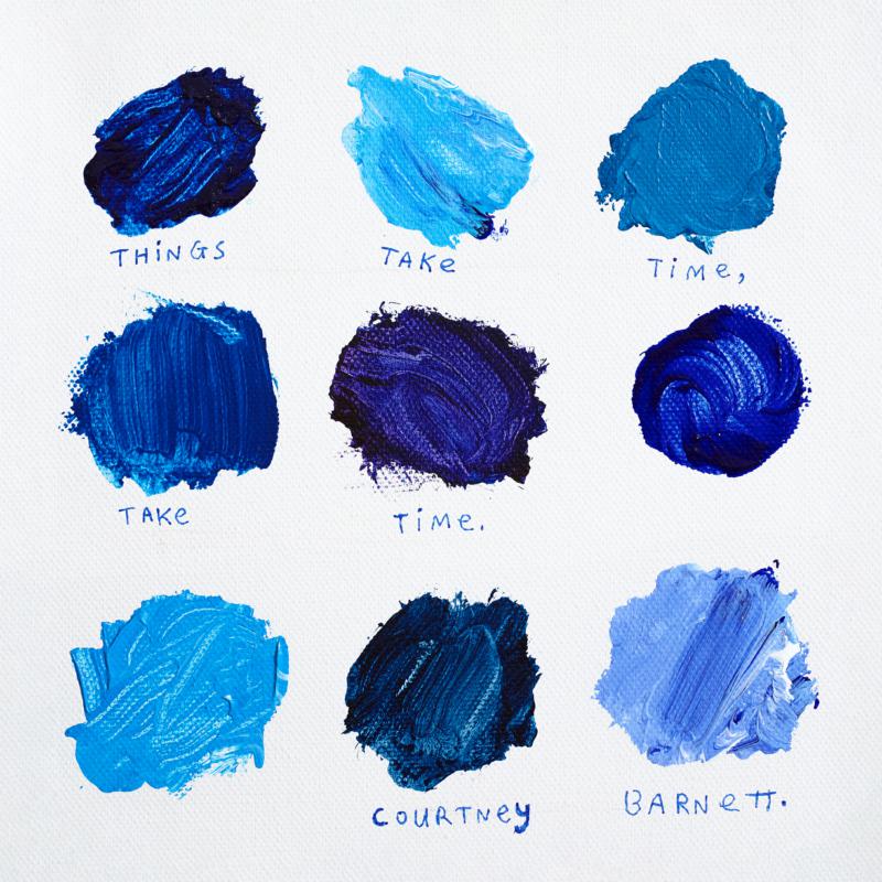 Nine blue paint swatches arranged in a grid with handwritten text.