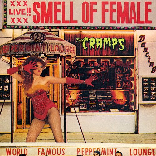 Album cover for The Cramps’ “Smell of Female” featuring a woman in red.