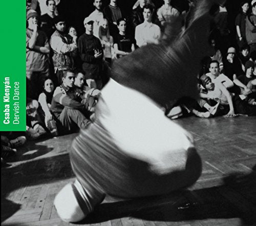 Black and white photo of a whirling dervish performing a dance.