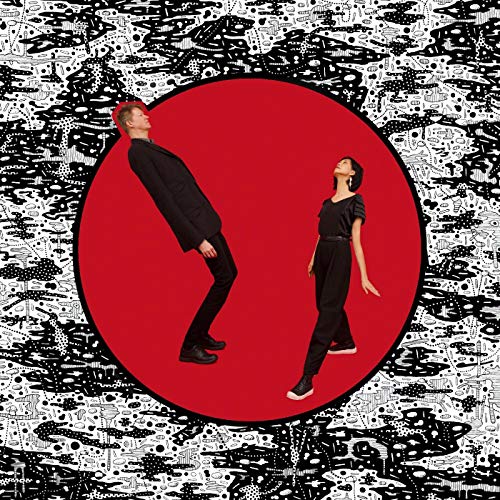 Two figures in black suits tilted within a red circle on a patterned background.