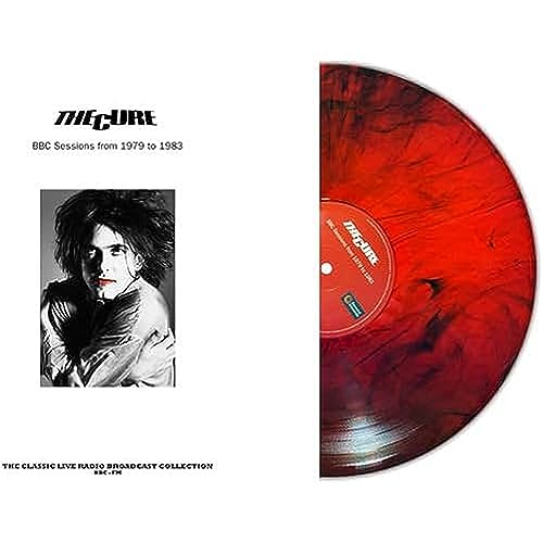 The Cure vinyl record, red marble effect, with Robert Smith portrait.
