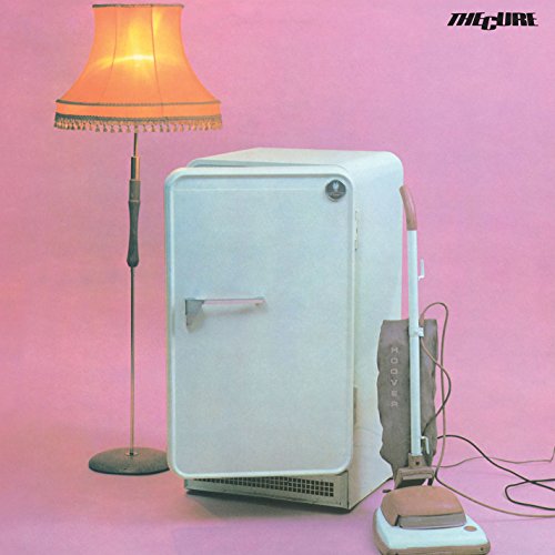 The Cure's "Three Imaginary Boys" vinyl album cover with a lamp, fridge, and vacuum.