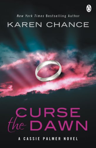 Book cover: dark clouds, a silver ring, and title "Curse the Dawn".