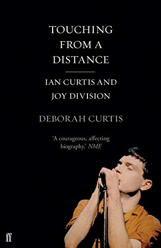 Book cover for Touching From a Distance featuring Ian Curtis singing into a microphone.