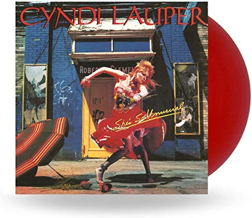 Cyndi Lauper's "She's So Unusual" vinyl record with red disc shown.