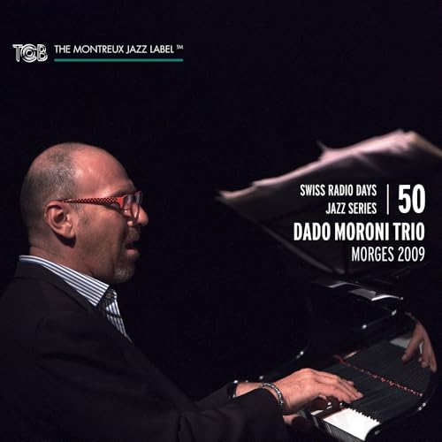 Jazz pianist Dado Moroni in profile, sheet music, CD cover.