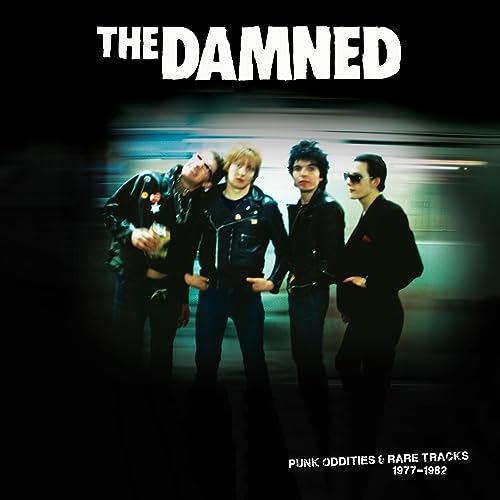 The Damned band portrait on a black background, vinyl record cover.