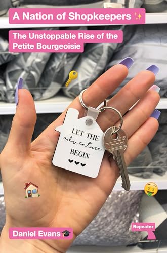Hand holding a house-shaped keychain with the text Let the adventure begin.