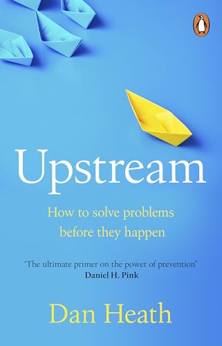 Book cover with blue background, one yellow and several blue paper boats, white text.