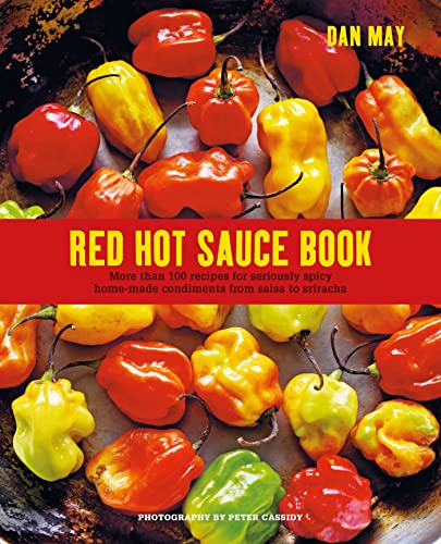 Cookbook cover with vibrant red, yellow, and orange chili peppers.