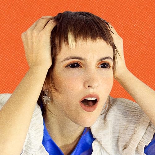 Dana Gavanski portrait, hands in hair, open mouth, orange background.