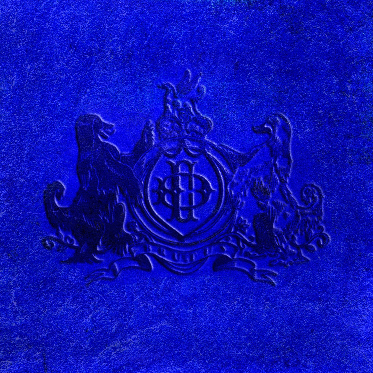 Blue CD cover for Daniel Caesar’s “NEVER ENOUGH” with embossed crest.
