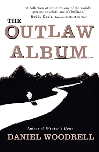 Book cover for The Outlaw Album by Daniel Woodrell featuring a black mountain landscape.