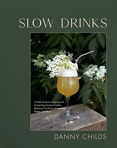Book cover with a cocktail glass and elderflower against a green background.