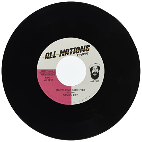 Black vinyl record with yellow label featuring portrait and text.