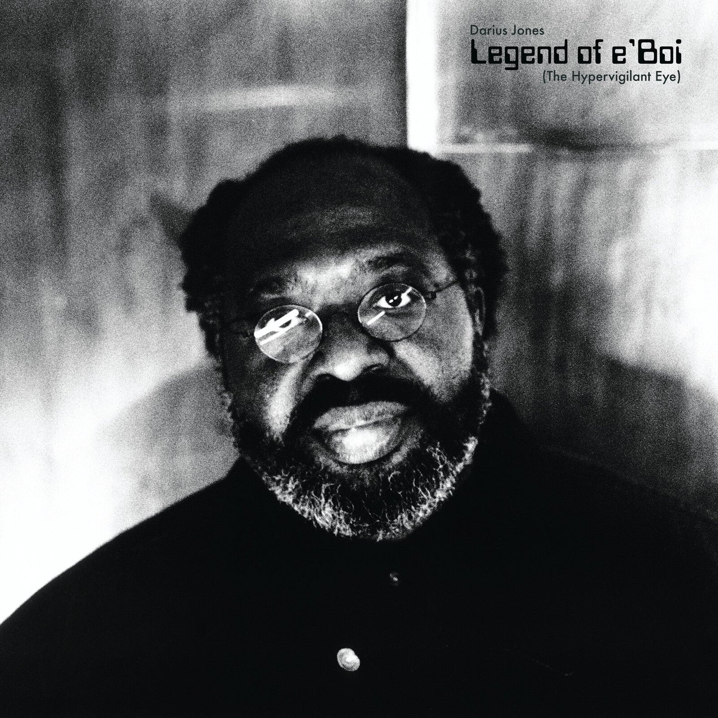 Black and white CD cover featuring portrait of Darius Jones with glasses.