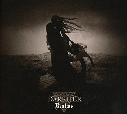 Darkher Realms CD cover: cloaked figure in a desolate, foggy landscape.