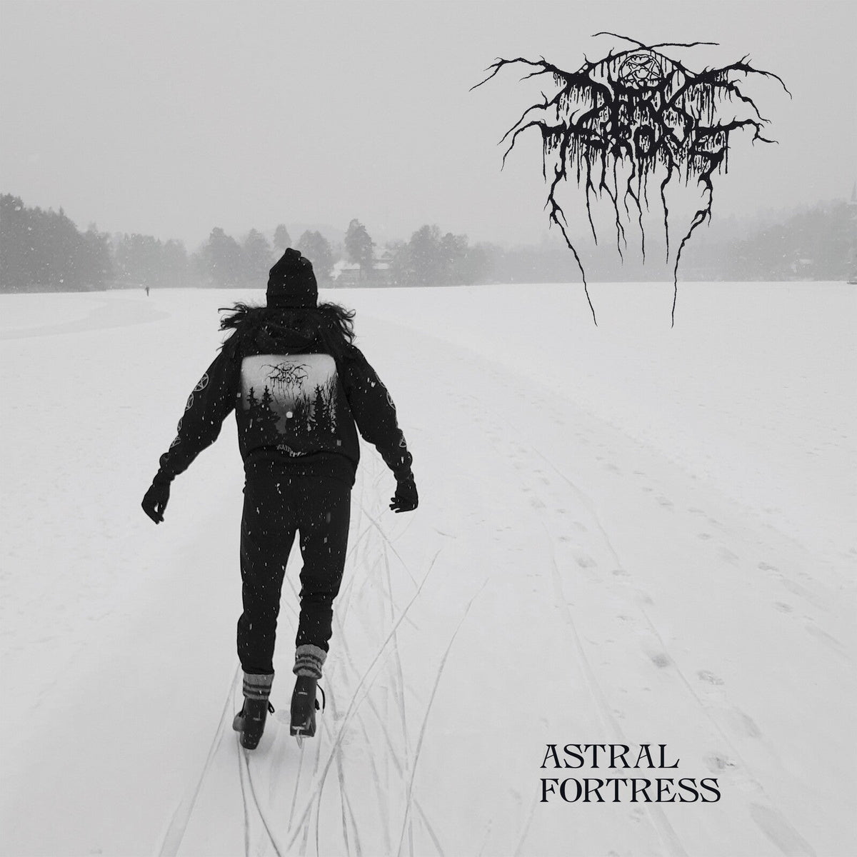 Person ice skating on a frozen lake in winter with Darkthrone logo and text.