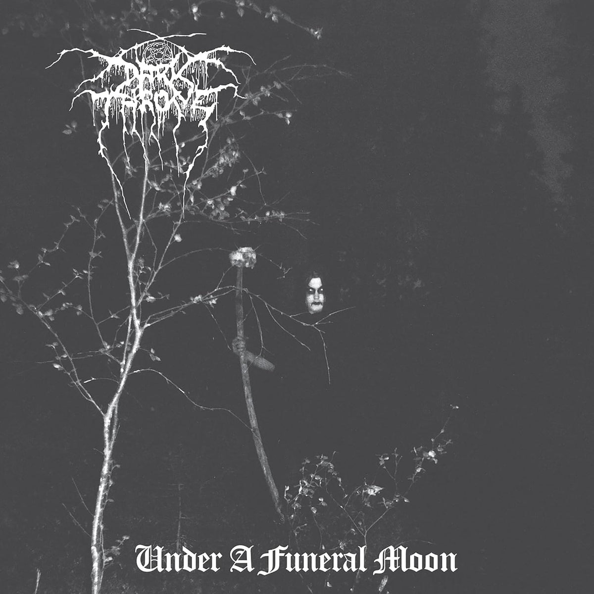 Black and white album cover featuring a close-up portrait of a corpse-painted man.
