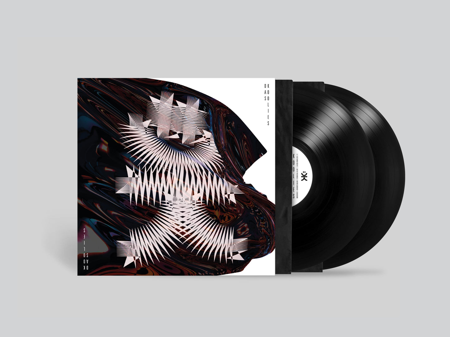 Double vinyl record with abstract, colorful cover art and black sleeves.