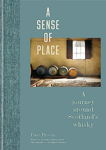 Book cover with whisky barrels in a stone warehouse interior.