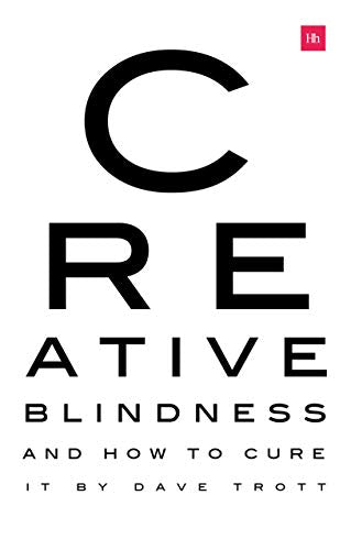 Book cover with large black letter "C" and title "Creative Blindness" below.