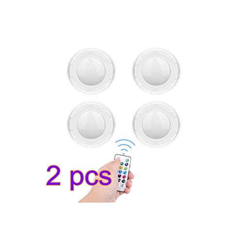 Four round, white LED puck lights with a remote control.