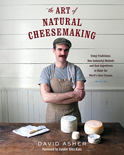 "Book cover featuring a man in an apron surrounded by cheeses on a wooden table."