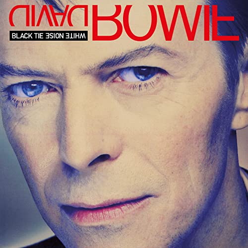 Close-up portrait of David Bowie with intense blue eyes, album cover.