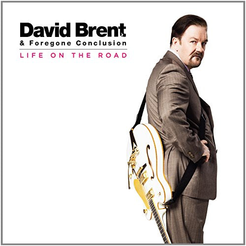 "Album cover featuring a man in a suit holding a guitar, white background."