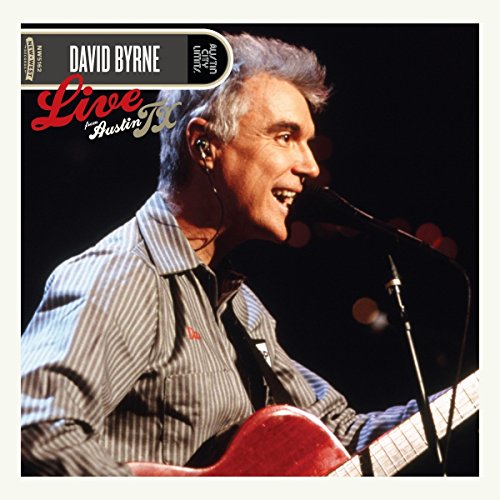 David Byrne performing live with a guitar, album cover art.