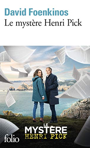 Book cover with a couple standing by the sea, papers falling.