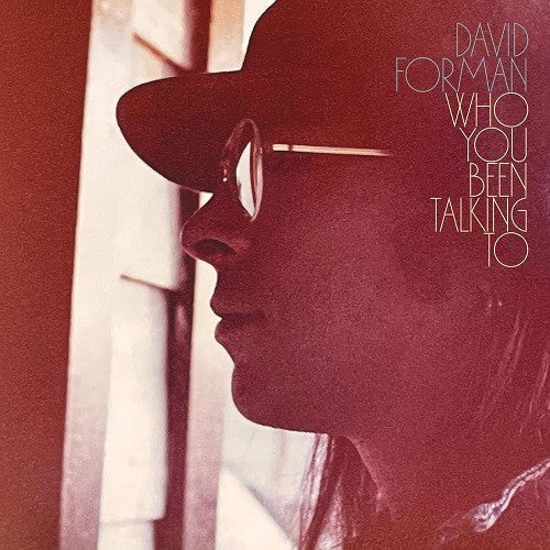 Red-toned album cover featuring a profile portrait of a man in sunglasses.