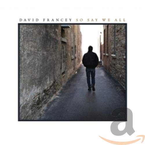 CD cover: man viewed from behind walking down a narrow stone street.