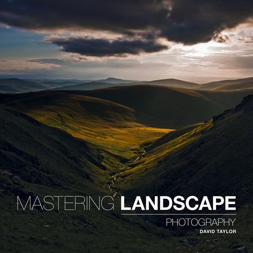 Book cover: rolling green hills under a dramatic, cloudy sky.