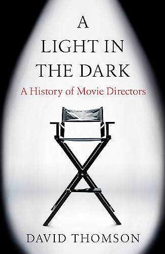 Book cover with director’s chair and title “A Light in the Dark.”