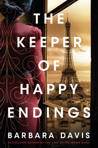 A woman in a red dress looks out a window at the Eiffel Tower.