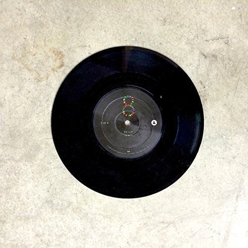 A black vinyl record with a gray label on a beige background.