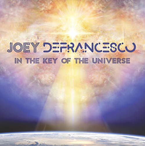 "Album cover with 'Joey Defrancesco - In The Key Of The Universe' text over a planet and sun."