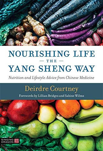 Book cover with colorful fruits, vegetables, and title “Nourishing Life.”