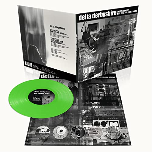 Green vinyl record with open gatefold sleeve showing studio equipment.