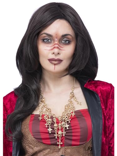 Woman wearing a gold skull necklace with dark makeup and long hair.