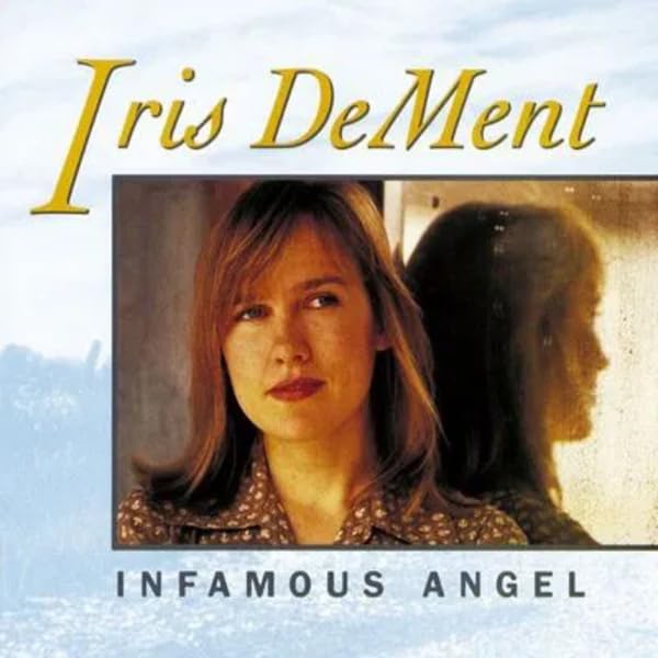 Album cover for Iris DeMent’s “Infamous Angel” featuring a portrait of the artist.