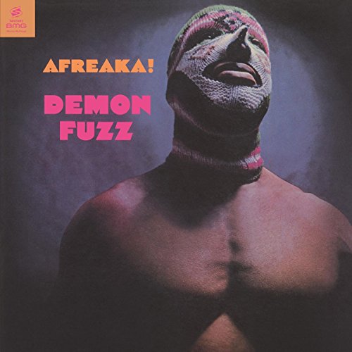 A shirtless man wearing a colorful knit balaclava, album cover for "Demon Fuzz - Afreaka!".