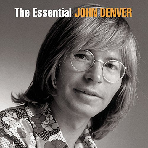 John Denver portrait on CD cover, wearing glasses and patterned shirt.