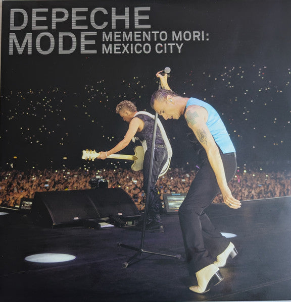 Depeche Mode album cover featuring band members performing live onstage.